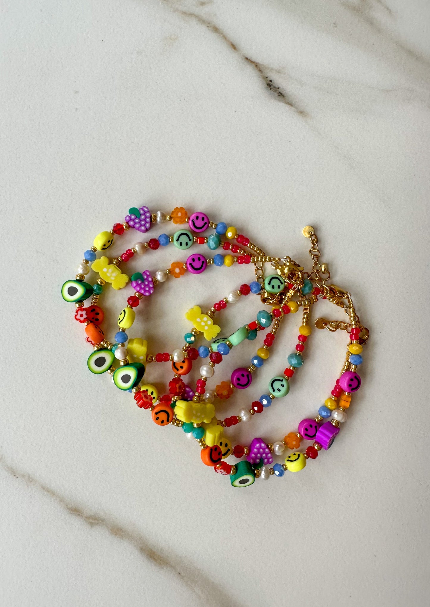 armbandje kralen kleuren vrolijk goud