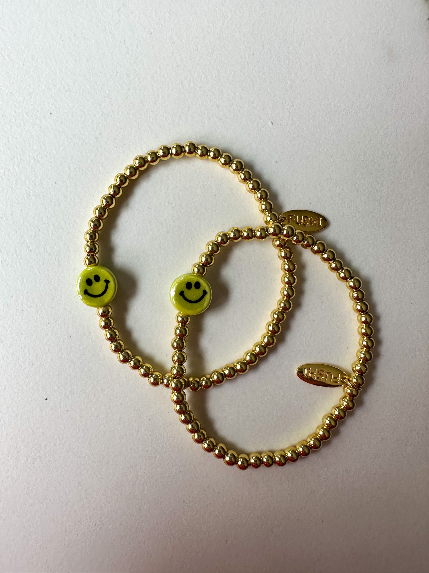 Armband goud met keramiek gele smiley - RUBY Conceptstore