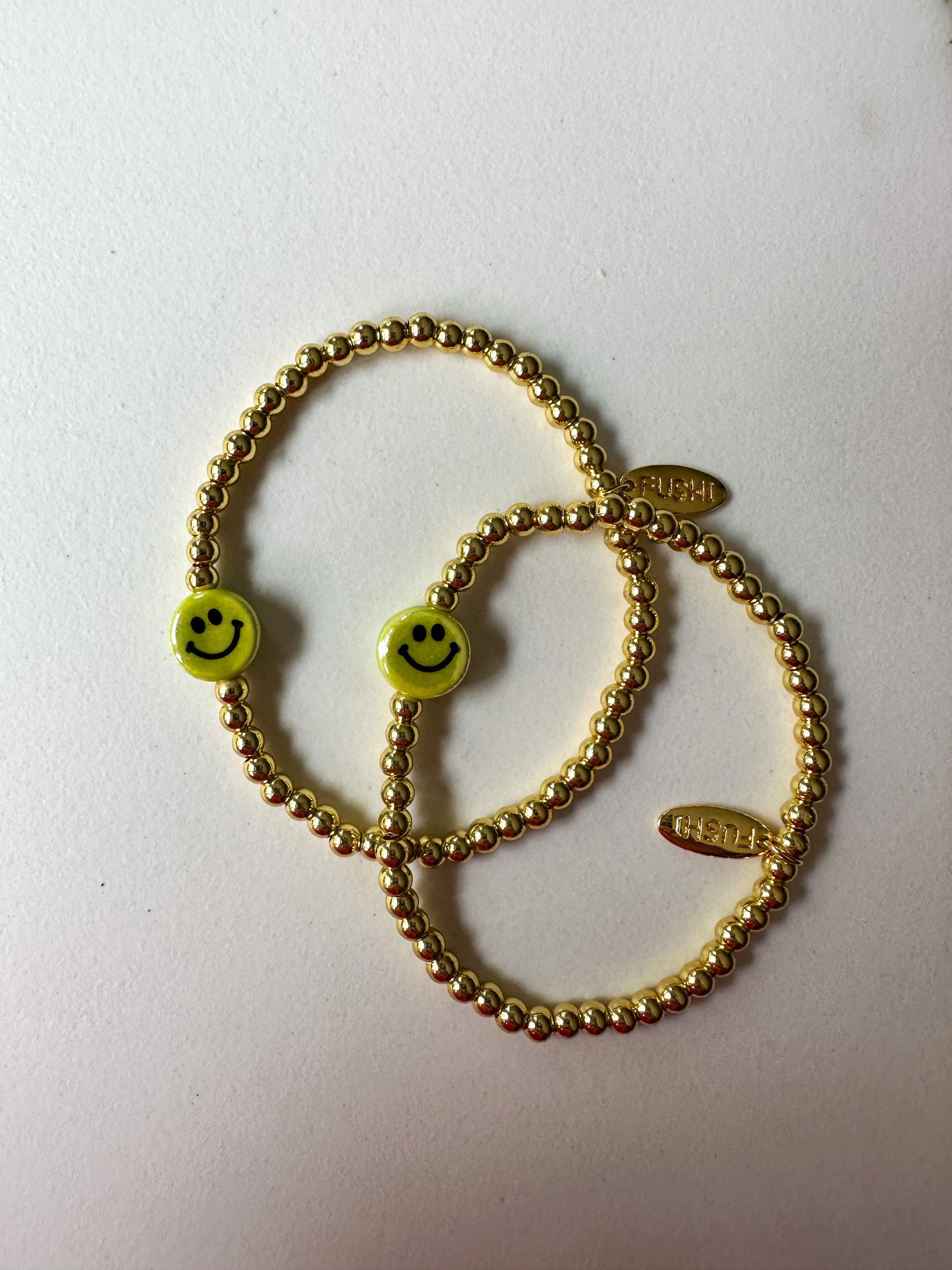 Armband goud met keramiek gele smiley - RUBY Conceptstore 